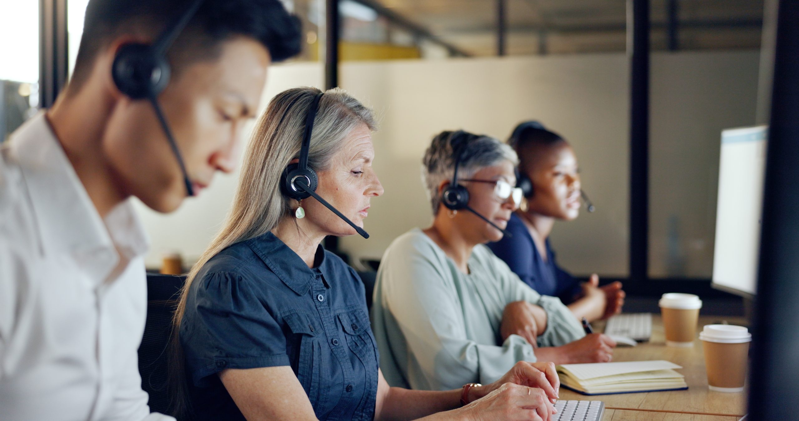 Customer support team assisting clients using employee assistance program services